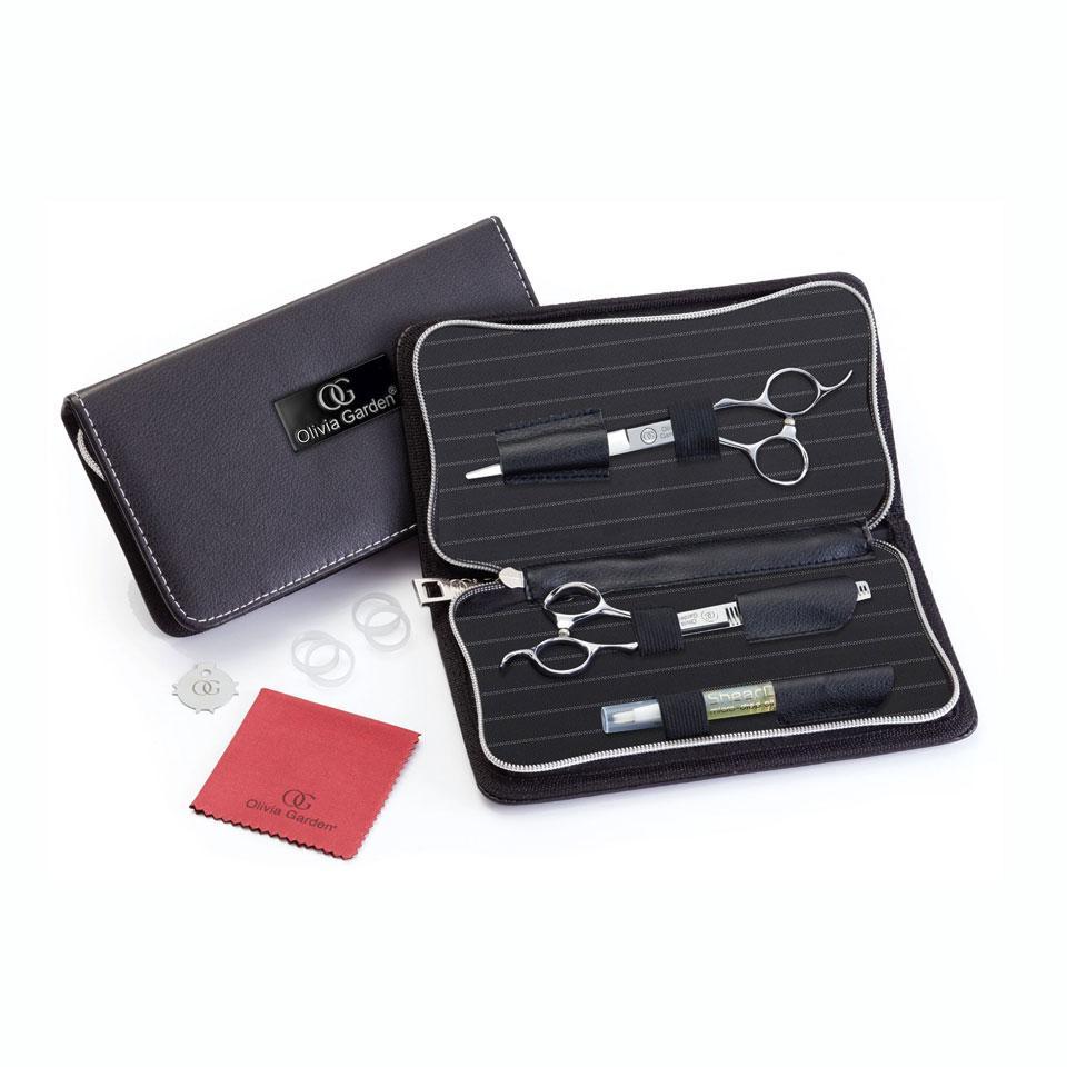 Kit Silkcut Pro aperto: forbice, pettine, accessori e panno rosso